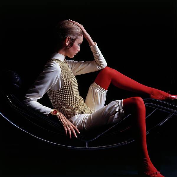 Accessories Poster featuring the photograph Twiggy Sitting On A Modern Chair by Bert Stern