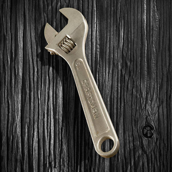 Black Poster featuring the photograph Adjustable Wrench over Black and White Wood 72 by YoPedro