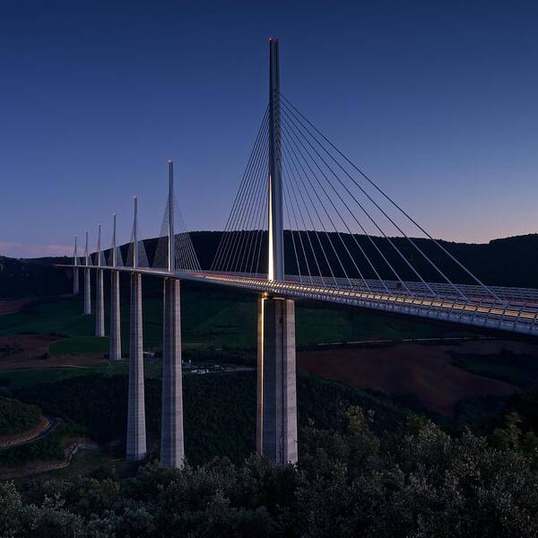 Millau Poster featuring the photograph Millau viaduct at dusk by Stephen Taylor