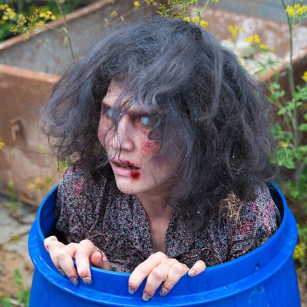 Zombie Poster featuring the photograph Zombie in barrel - scary and funny by Matthias Hauser