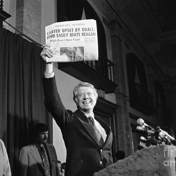 Mature Adult Poster featuring the photograph Carter Holds An Incorrect Newspaper by Bettmann