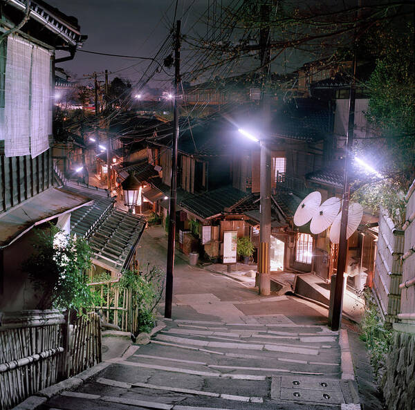 Electricity Pylon Poster featuring the photograph Kyoto Street At Night by Peter Kindersley