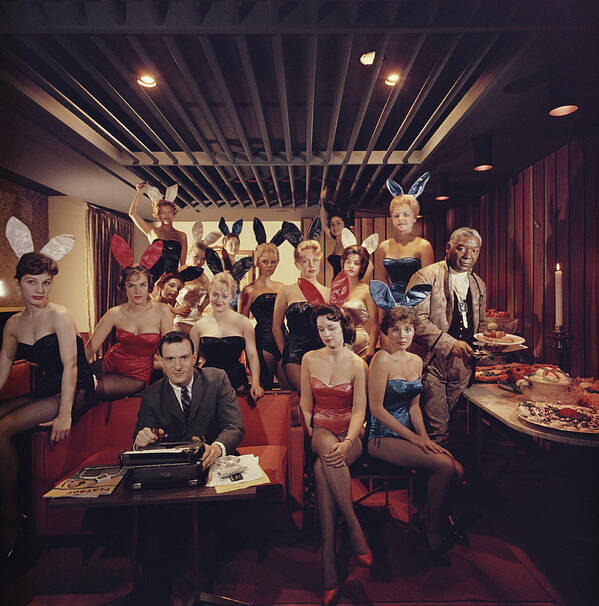 Hugh Hefner Poster featuring the photograph Mans Work by Slim Aarons