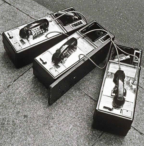 Telephone Poster featuring the photograph Public Phones Lying On Sidewalk by Henri Silberman