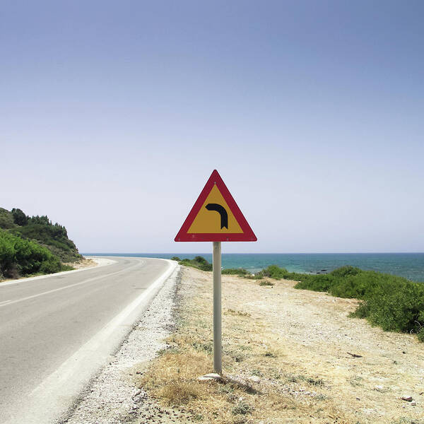 Tranquility Poster featuring the photograph Road With Traffic Sign And Sea by Halfoto.hu