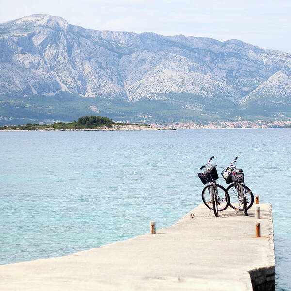 Scenics Poster featuring the photograph Two Bicycles On A Pier In Croatia by Carolin Voelker