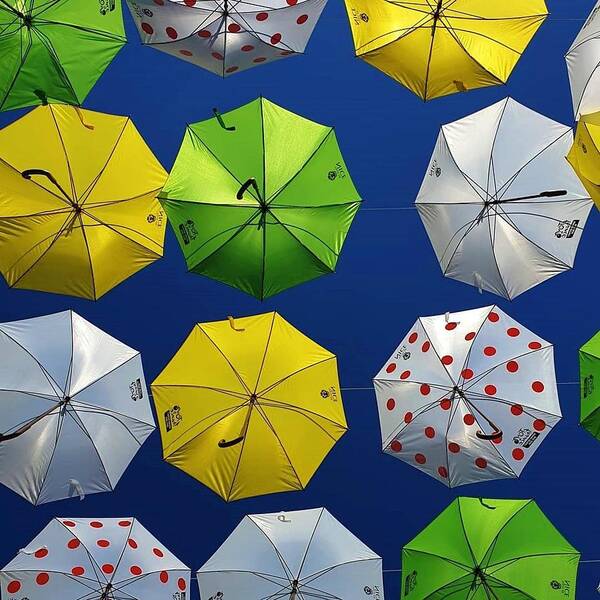 Umbrellas Poster featuring the photograph Might Rain by Andrea Whitaker