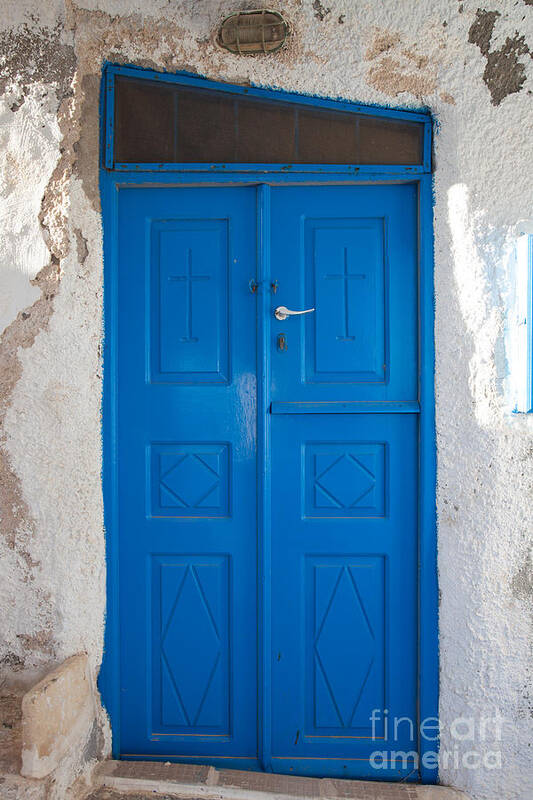 Blue Poster featuring the photograph Blue door of a church in Santorini by Matteo Colombo