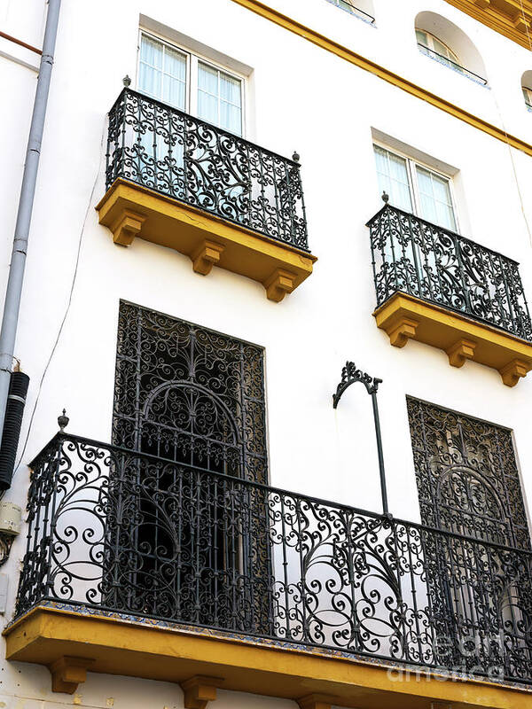 Wrought Iron Style In Seville Poster featuring the photograph Wrought Iron Style in Seville by John Rizzuto