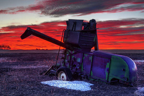 Combine Harvester Antique Abandoned Vintage John Deere Sunrise Landscape Red Green Snow Winter Art Print featuring the photograph Combine Towards the Light by Peter Herman