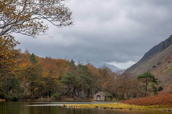 Autumn Art Print featuring the photograph Moody clouds over a boathouse on Wast Water in the Lake District by Neil Alexander Photography