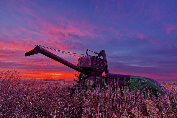 John Deere Art Print featuring the photograph Hoping for Another Harvest - vintage John Deere combine before a ND sunrise by Peter Herman