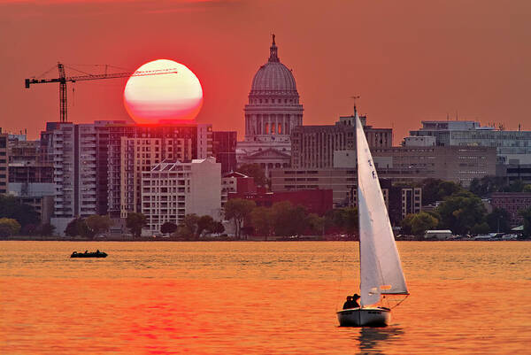 Madison Art Print featuring the photograph Madison Equinox - Sun setting near madison WI capitol dome with lake monona and sailboat by Peter Herman
