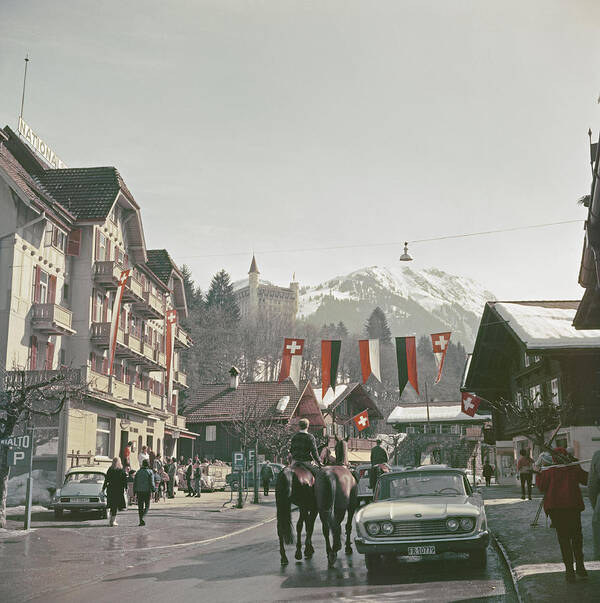 Gstaad Art Print featuring the photograph Gstaad Town Centre by Slim Aarons