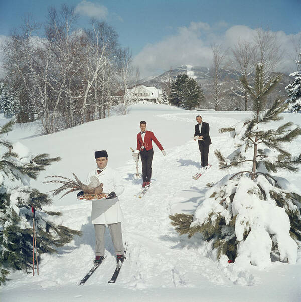 Skiing Art Print featuring the photograph Skiing Waiters by Slim Aarons