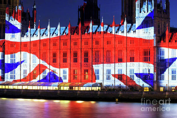 Union Jack On The Palace Of Westminster Art Print featuring the photograph Union Jack on the Palace of Westminster in London by John Rizzuto