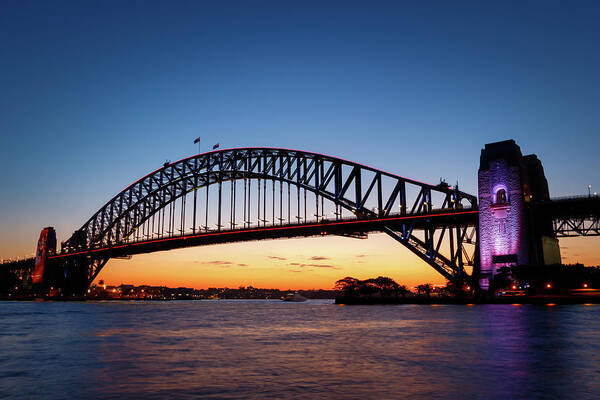 Arch Art Print featuring the photograph Sydney Harbour Bridge illuminated at sunset by Rick Deacon