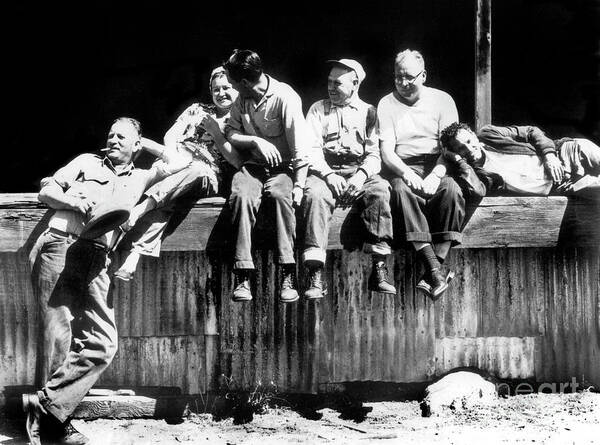 Cannery Art Print featuring the photograph Canney workers take a brake on the loading dock of Hovden Cannery 1950 by Monterey County Historical Society