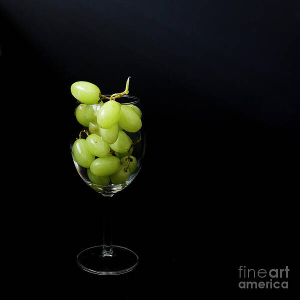 Glass Art Print featuring the photograph A glass of white wine by Agnes Caruso