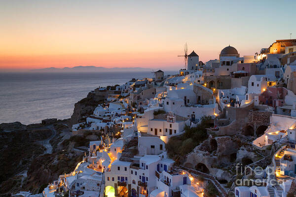 Greece Art Print featuring the photograph Romantic sunset over the village of Oia Greece Santorini by Matteo Colombo
