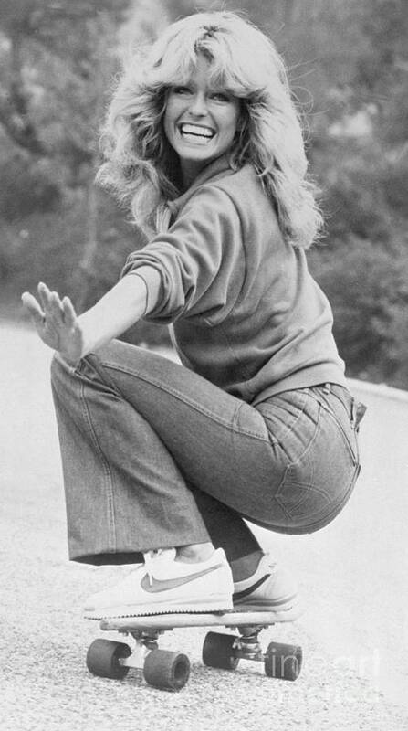 Charlie's Angels Art Print featuring the photograph Farrah Fawcett Riding Skateboard by Bettmann