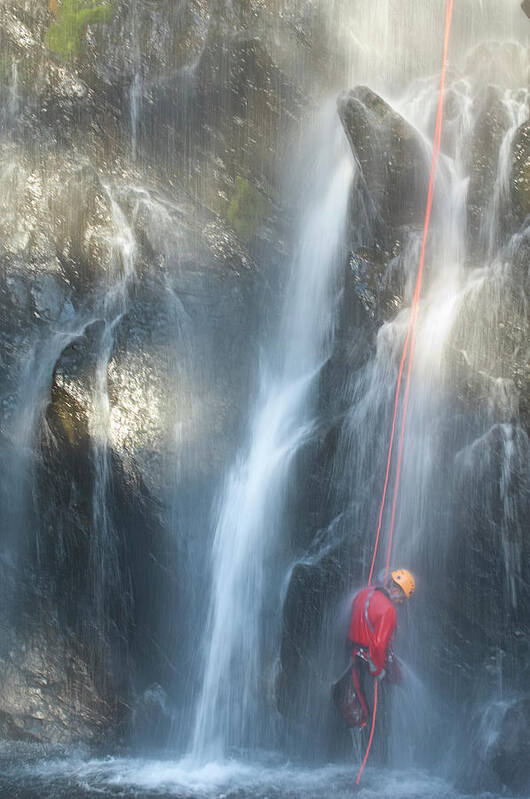 Abseil Art Print featuring the photograph Man Canyoning Down A Waterfall #2 by Frank Huster