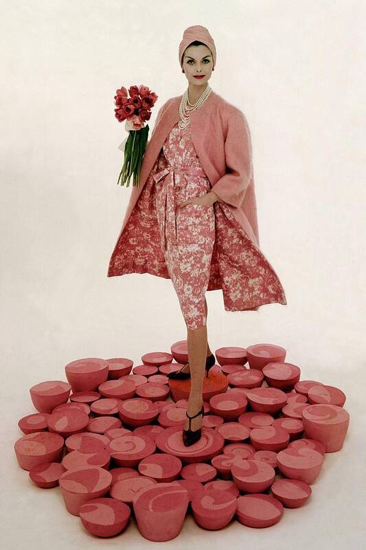 Fashion Art Print featuring the photograph A Model Wearing A Matching Pink Outfit Holding by William Bell