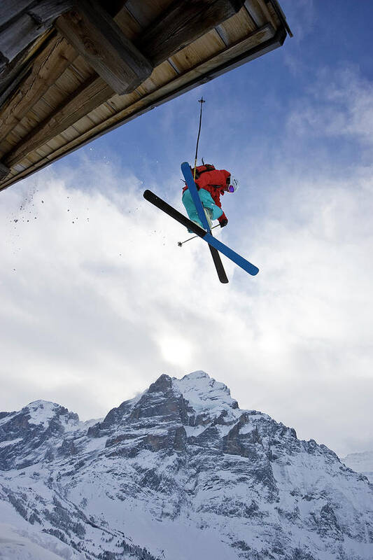 Adventure Art Print featuring the photograph A Young Man Skis Off The Roof Of An by Henry Georgi