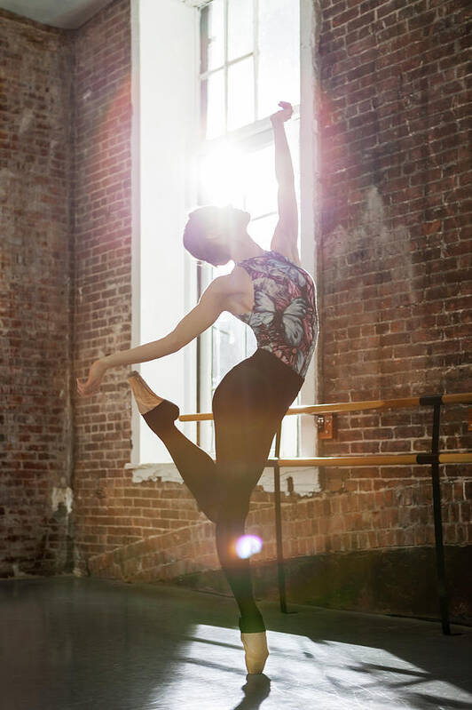 Ballet Dancer Art Print featuring the photograph Ballerina Performing Balance On Pointe by Nisian Hughes