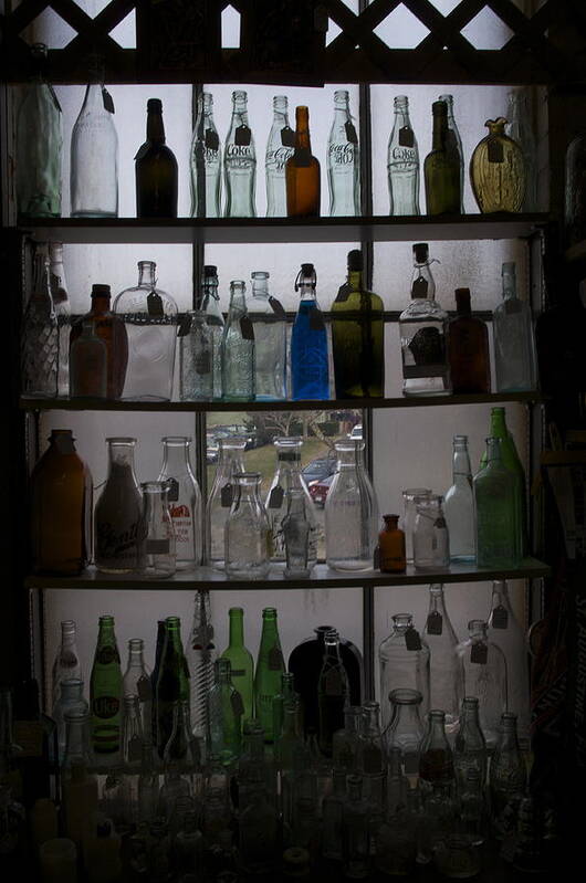 Glass Art Print featuring the photograph Glass bottles by Micaela Brown