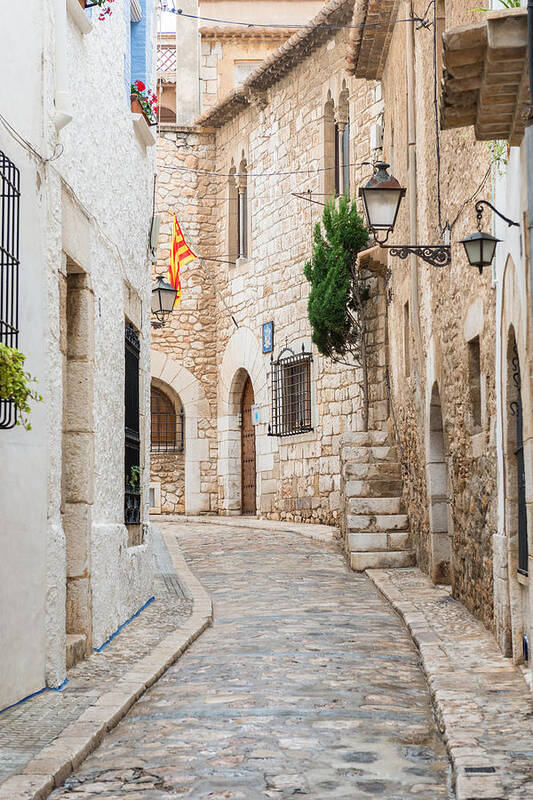 Street Art Print featuring the photograph Medieval street in Sitges old town Spain by Marek Poplawski
