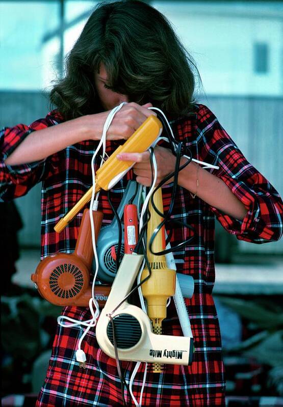 Beauty Art Print featuring the photograph Model Holding Hair Dryers by William Connors