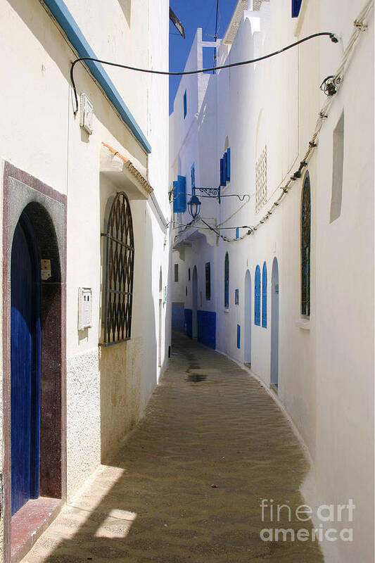 Narrow Backstreet Of Asilah Art Print featuring the photograph Narrow Backstreet in the Medina of Asilah on Northwest tip of Atlantic Coast of Morocco by PIXELS XPOSED Ralph A Ledergerber Photography