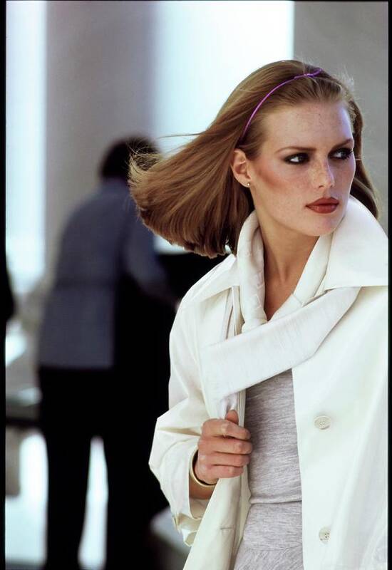 Fashion Art Print featuring the photograph Patti Hansen Wearing A White Raincoat by Arthur Elgort