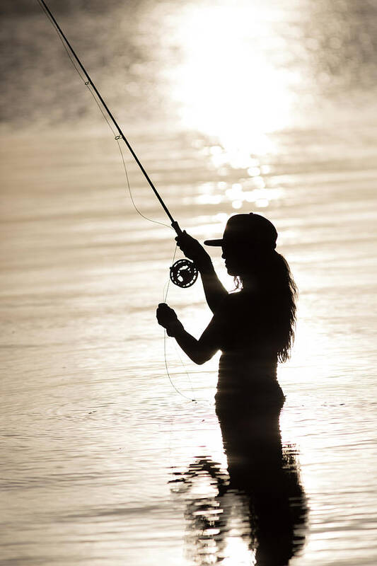 Silhouette Of Woman Fly-fishing Art Print