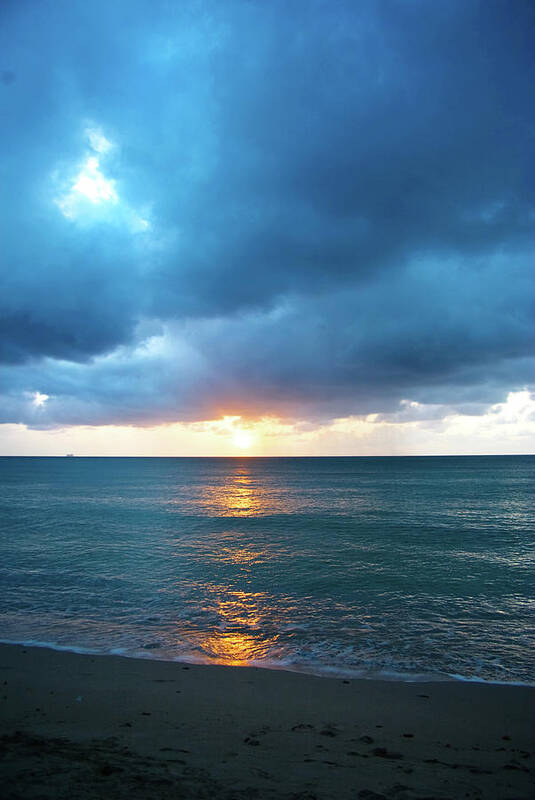 Water's Edge Art Print featuring the photograph Stormy Clouds Seascape At Sunset by Jaminwell