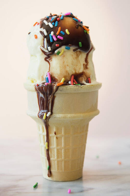 Melting Art Print featuring the photograph Studio Shot Of Ice Cream Cone With by Jamie Grill