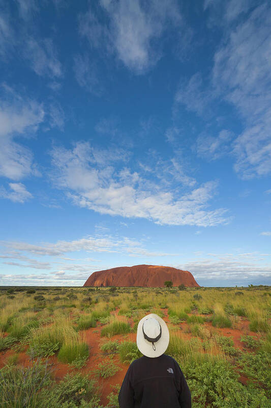 00477467 Art Print featuring the photograph Tourist And Clouds At Ayers Rock by Yva Momatiuk John Eastcott
