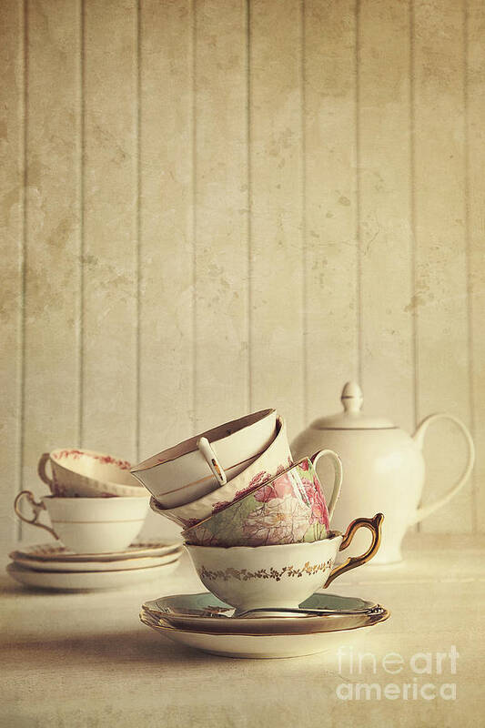 Atmosphere Art Print featuring the photograph Vintage tea cups stacked with wood background by Sandra Cunningham