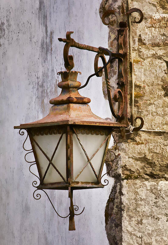 Obidos Art Print featuring the photograph Weathered Wrought Iron Street Lamp of Medieval Europe by David Letts