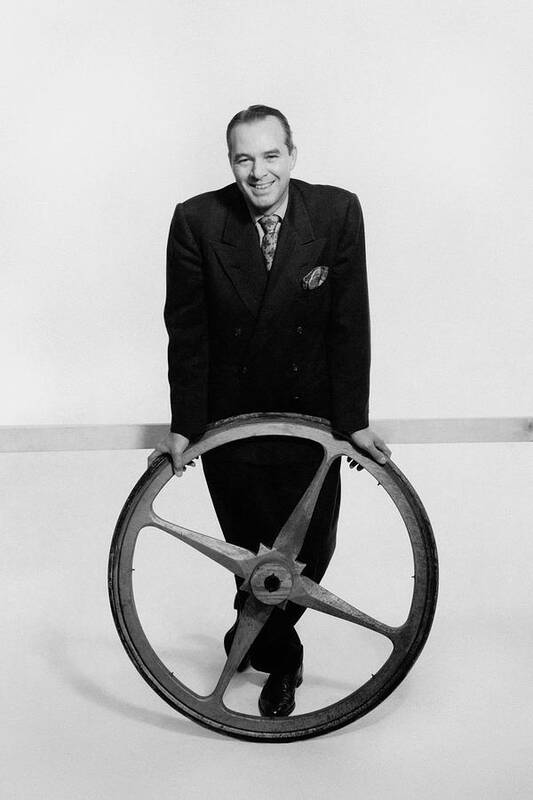 Designer Art Print featuring the photograph William Pahlmann Holding A Wheel by Herbert Matter