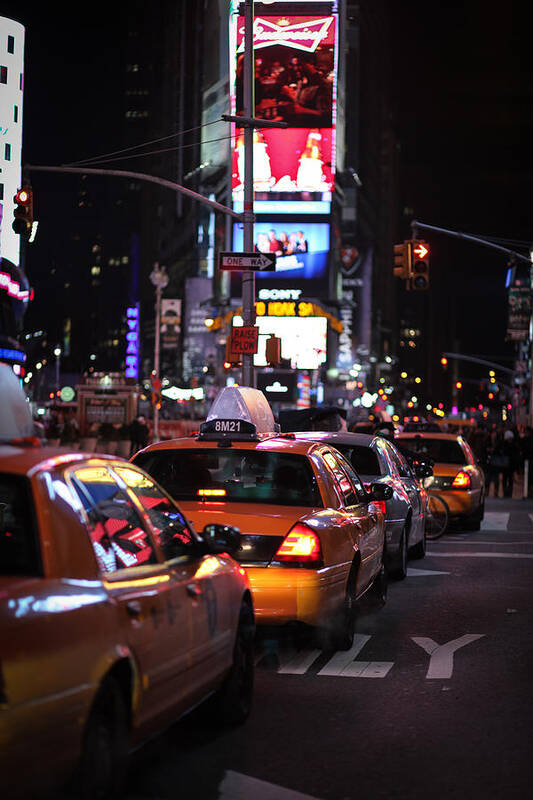 Cab Art Print featuring the photograph Yellow cabs at Times Square by Simon Svedhage