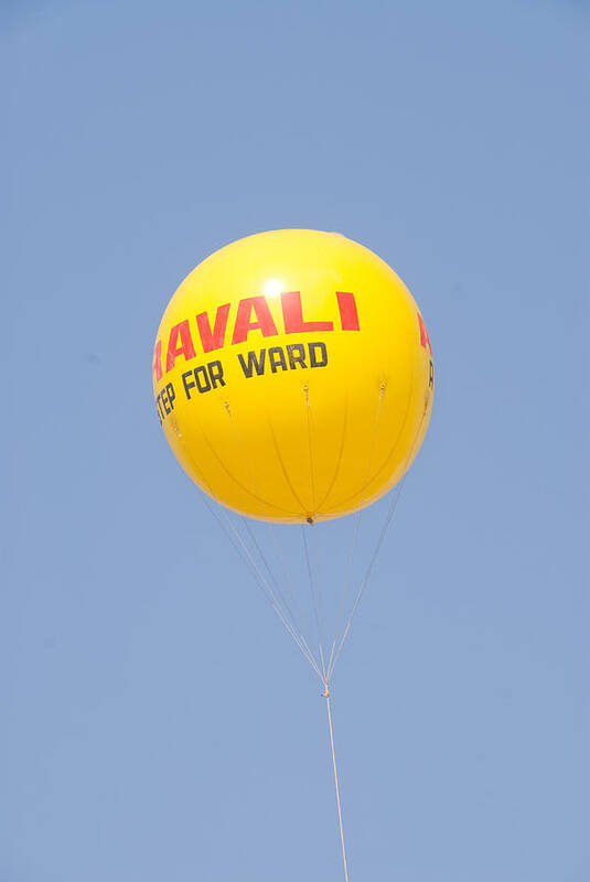Balloon Art Print featuring the photograph A hot air balloon in the blue sky by Ashish Agarwal