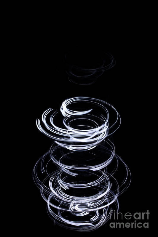 Swirl Art Print featuring the photograph White upward swirl on black background by Simon Bratt