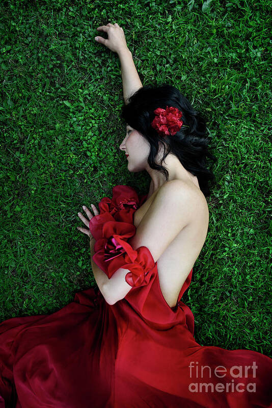 Woman Art Print featuring the photograph A woman sleeping on the grass in a red dress by Jelena Jovanovic