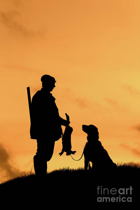 Hunter Art Print featuring the photograph Hunter with Dog at Sunset by Arterra Picture Library
