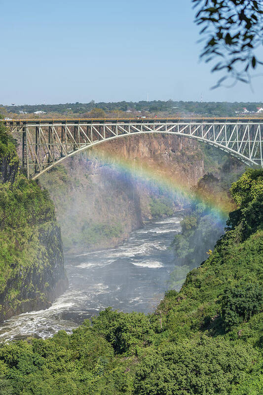 Africa Art Print featuring the photograph Rainbow crossing gorge beneath Victoria Falls Bridge by Ndp 