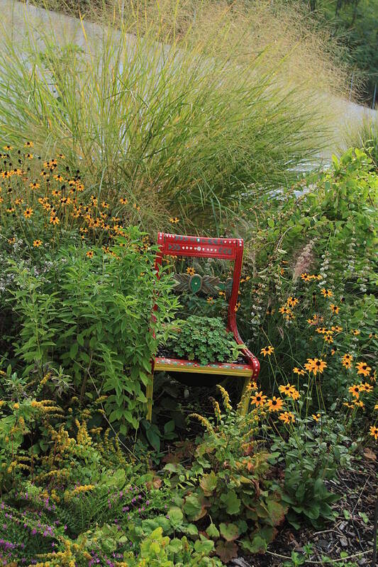 Flowering Bridge Art Print featuring the photograph Red Chair in Garden by Karen Ruhl