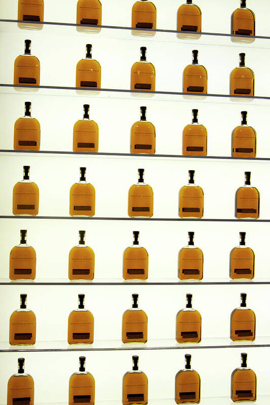 American Art Print featuring the photograph Woodford Reserve Visitors Center bottle display by Karen Foley