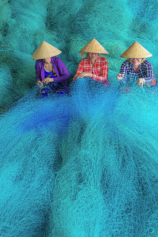Blue Art Print featuring the photograph Vietnam Women Repairing Fishing Nets #1 by Tom Norring